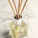 Aromatherapy reed diffuser air freshener on marble background